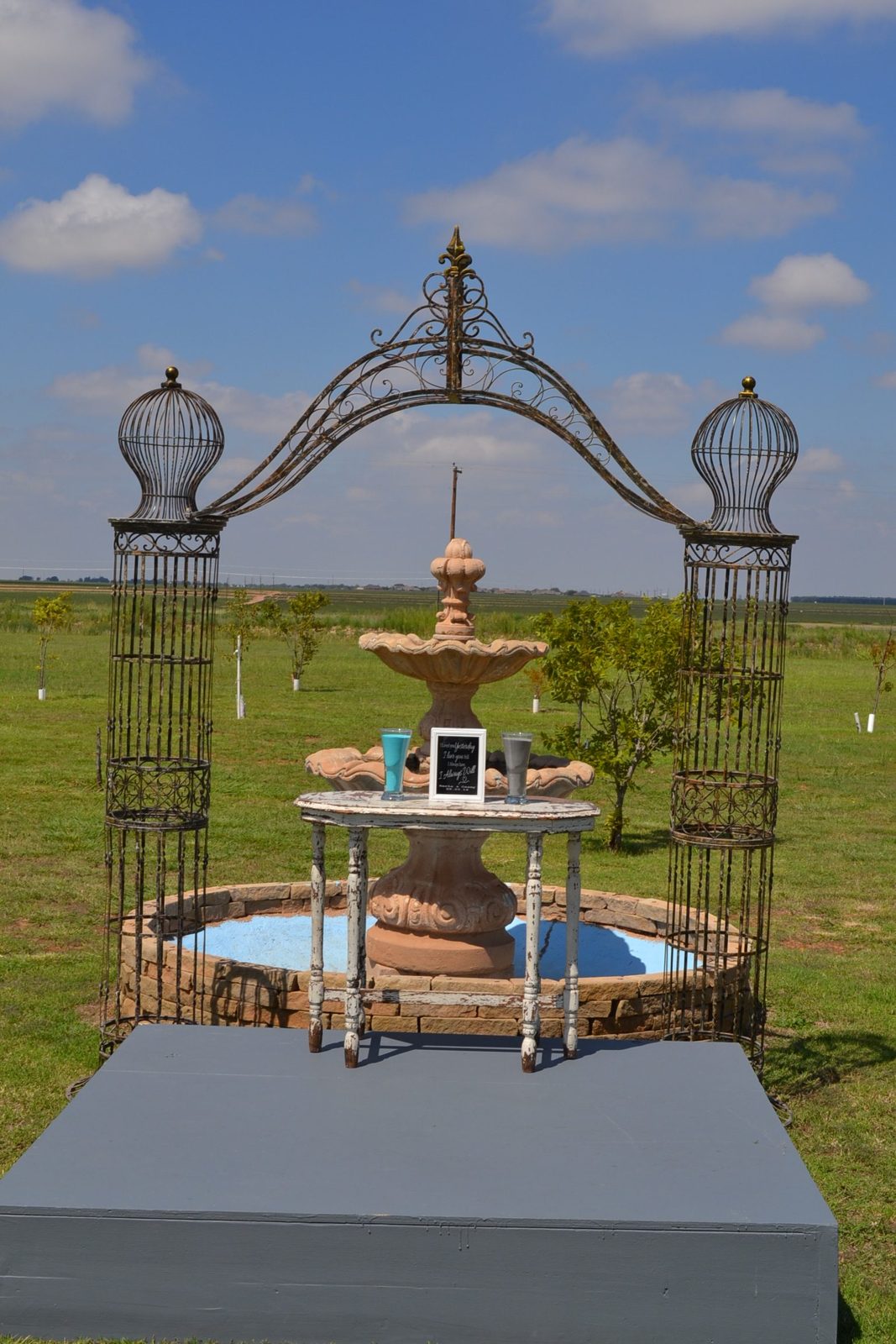 Outdoor fountain and ceremony arch